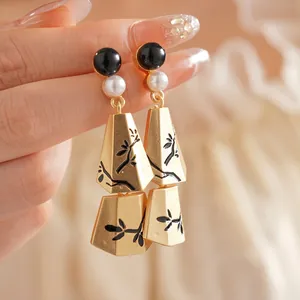 Elegant gold pearl earrings with black branch pattern and long tassel tassels pendants