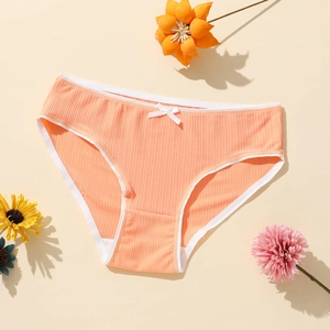 Women's orange ribbed polyester panties with low waist and decorative white bow