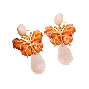 Vintage gold butterfly drop earrings with pink resin wings and white teardrop pearls