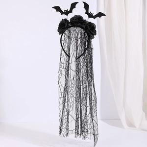 Detail of a Gothic Halloween headband featuring black roses, bat wings, and a long lace veil
