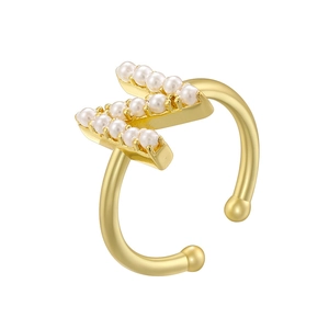 Detail of adjustable gold ring with inlaid white pearls in a stylized K shape design