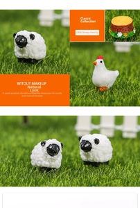 Miniature resin farm animals on green moss with lamb, chicken and stump figurines