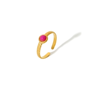 Detail of gold-plated hammered ring featuring a vibrant rose red gemstone inlay