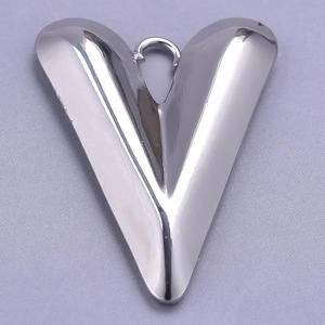 Macro shot of silver heart pendant made of 304 stainless steel with V-shaped design