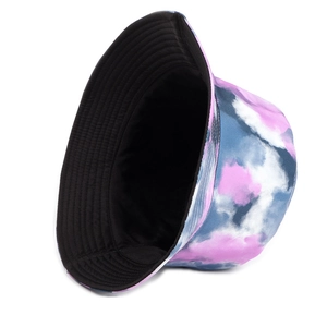 Reversible tie-dye bucket hat in pink and blue patterns with a solid black inner lining