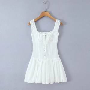 Detail of white cotton lace embroidery dress with square neck and button-down front