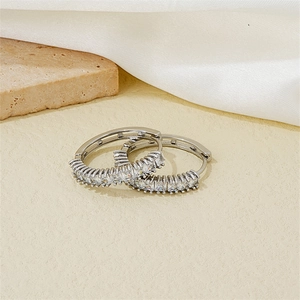 Elegant silver hoop earrings with channel-set cubic zirconia crystals in a luxury style