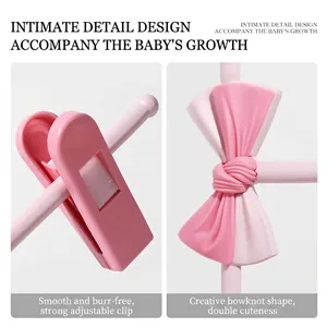 Adjustable anti-slip pink baby clothes hanger with cute bow and rounded safety design