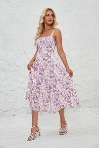 Close-up detail of white and purple floral print on the French style slit sundress