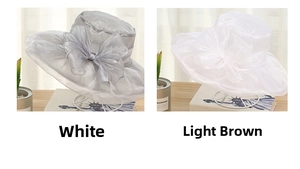 Detail of elegant organza sun hats with oversized bows in silver gray and white
