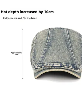 Detail view of washed denim newsboy cap with 10cm depth and structured stitch panels