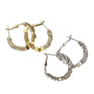 Minimalist geometric C-shape hoop earrings with crystal pavé and polished metal disks