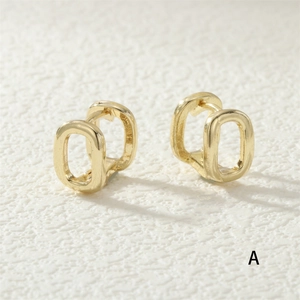 Detail of 18K gold plated horseshoe earrings featuring micro-set zircon and geometric loops