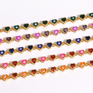 Detail of colorful Evil Eye heart bracelets with gold plating and zircon crystals