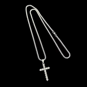 Hip hop silver cross necklace with sparkling zircons and mesh chain on black background