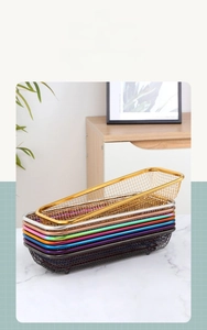 Stack of rectangular stainless steel mesh baskets in various colors with supporting feet