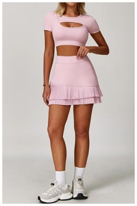 Close-up of pink sports skirt with fine pleated hem and built-in liner for women