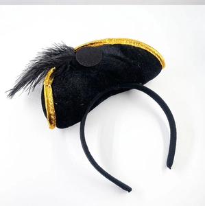 Close-up of pirate captain headband with black feather, gold trim and skull details