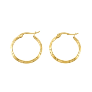 Golden spiral hoop earrings with Greek key pattern on a clean white background