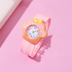 Pink cupcake-shaped kids cartoon watch with soft silicone strap on a matching background