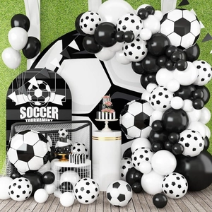 Close-up of soccer tournament party set with black and white football printed balloons