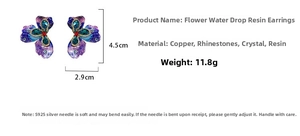 Detail view of purple floral resin earrings with multi-color rhinestones and 4.5cm length