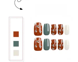 Short square press-on nails set featuring green, cream, and heart patterned designs