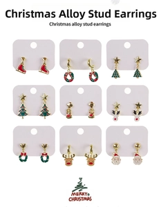 Close-up of nine pairs of Christmas stud earrings with Santa, reindeer and tree motifs