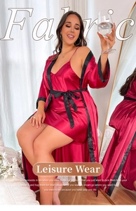 Detailed macro view of wine red silk satin robe with black contrast trim and tie waist