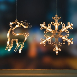 Hanging warm yellow LED Christmas lights with snowflake and reindeer decorative shapes