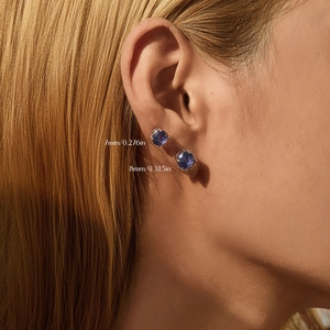 S925 sterling silver tanzanite-colored round earrings in 7mm and 8mm sizes on model
