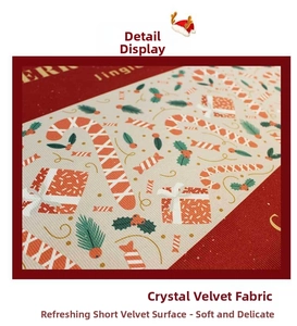 Close-up of soft crystal velvet Christmas mat fabric with festive candy cane pattern