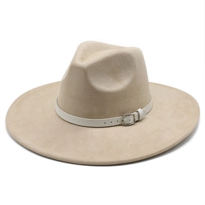 Detail of beige suede wide-brim fedora hat with white leather strap and silver buckle