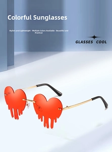 Detail of red heart-shaped rimless sunglasses with unique fluid drip lens design