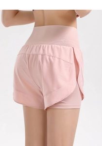 Rear view of pink high-waisted gym shorts with layered anti-exposure split hem design