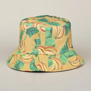 Close-up of tropical banana and green leaf prints on a durable cotton bucket hat detail