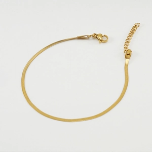 Detail of 18K gold plated stainless steel flat snake chain with lobster clasp and extender