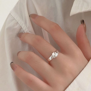Minimalist 925 sterling silver geometric knot ring with a modern faceted paper-style design