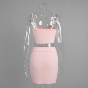 Rear view of pink fuzzy knit two-piece set featuring cropped camisole and mini skirt