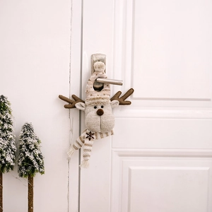 Christmas reindeer door hanger featuring brown knit hat and scarf with snowflake patterns
