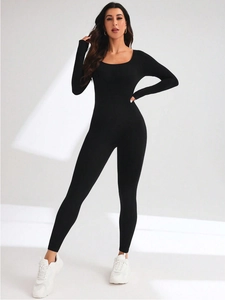 Slim fit black long sleeve bodysuit with scoop neck for yoga and fitness activewear