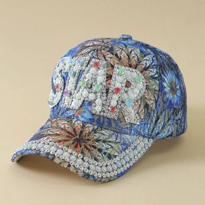 Detail of denim baseball cap featuring STAR rhinestone letters and pearl embroidery
