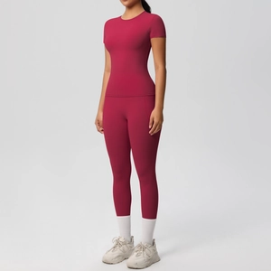 Macro detail of breathable high-waist yoga pants and slim-fit short sleeve sportswear set