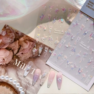 Macro view of TL-397 laser butterfly and flower nail art stickers with iridescent finish