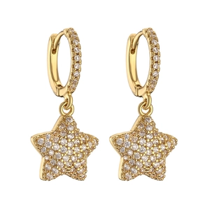 Macro shot of gold star hoop earrings featuring micro-pave cubic zirconia crystals