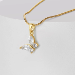 Elegant gold butterfly pendant necklace with cubic zirconia on smooth snake chain