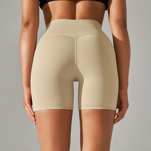 Detail view of khaki high-waisted yoga shorts with V-shaped back seam and slim fit