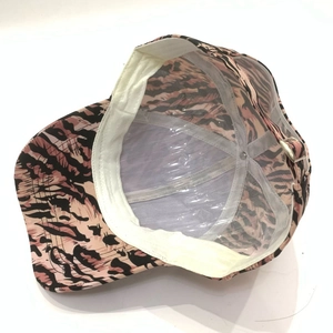 Pink leopard baseball cap detail with interior mesh lining and adjustable metal buckle
