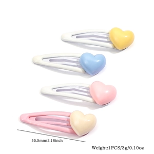 Set of four colorful heart snap hair clips with dimensions 55.5mm and weight details