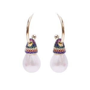 Elegant gold drop earrings with rainbow zircons and large white teardrop pearls on white background